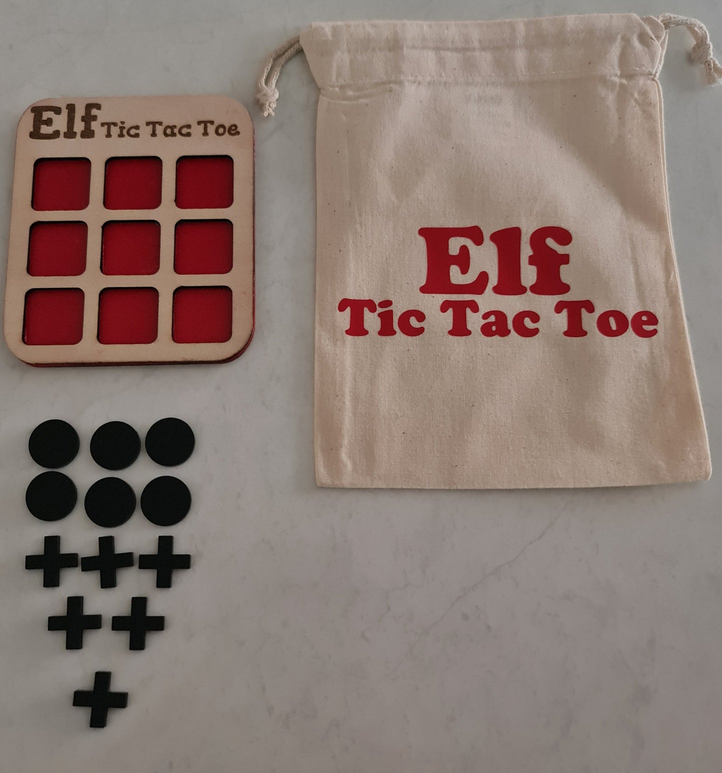 Elf Tic Tac Toe game board, tokens, and storage bag