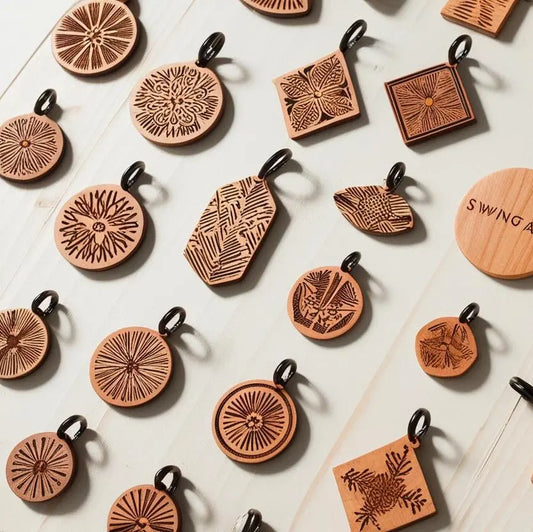 Timber swing tags in custom shapes and sizes with laser etching.